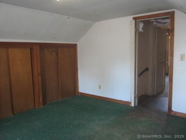 242 Elm St, Enfield, CT 06082 - bonus room with vaulted ceiling, baseboards, and carpet floors
