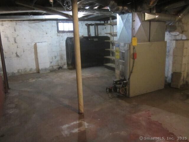 242 Elm St, Enfield, CT 06082 - unfinished basement featuring heating fuel and heating unit