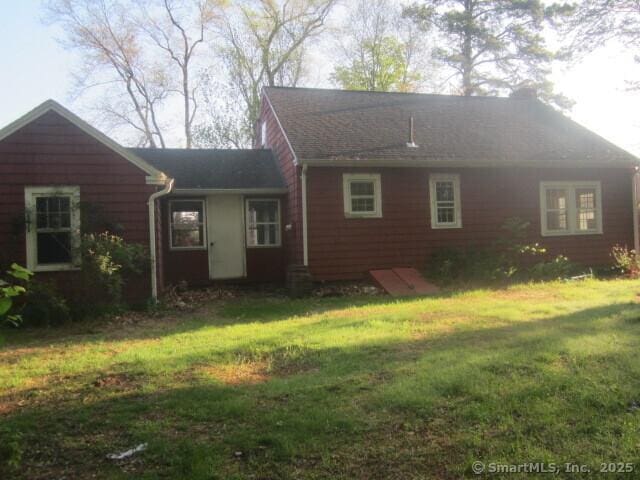 242 Elm St, Enfield, CT 06082 - view of front facade featuring a front yard