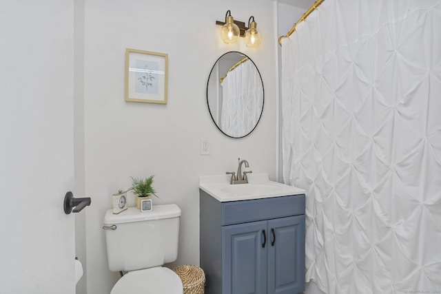 full bathroom with vanity and toilet