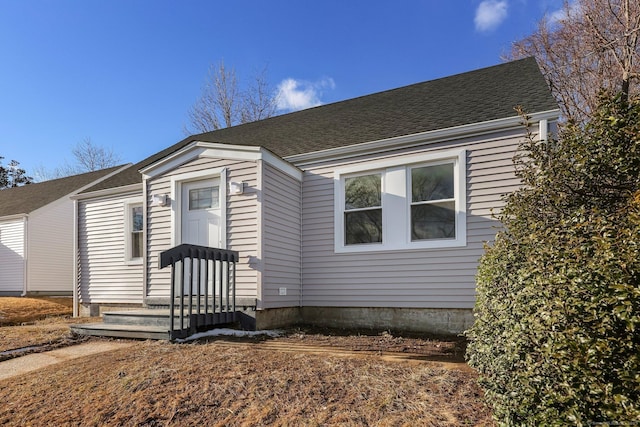 view of front of house featuring a shingled roof