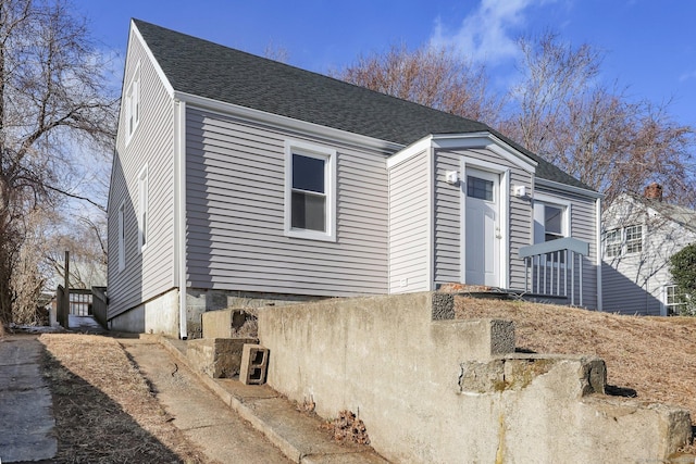 view of front of home with a shingled roof