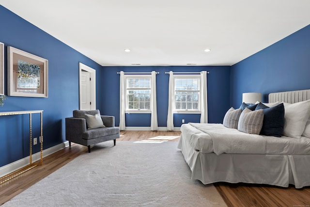 bedroom with recessed lighting, baseboards, and wood finished floors