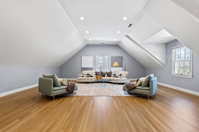 sitting room with baseboards, visible vents, plenty of natural light, and light wood finished floors