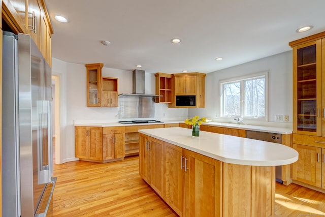 37 Skyline Dr, Groton, CT 06340 - kitchen with appliances with stainless steel finishes, wall chimney exhaust hood, light wood finished floors, open shelves, and light countertops