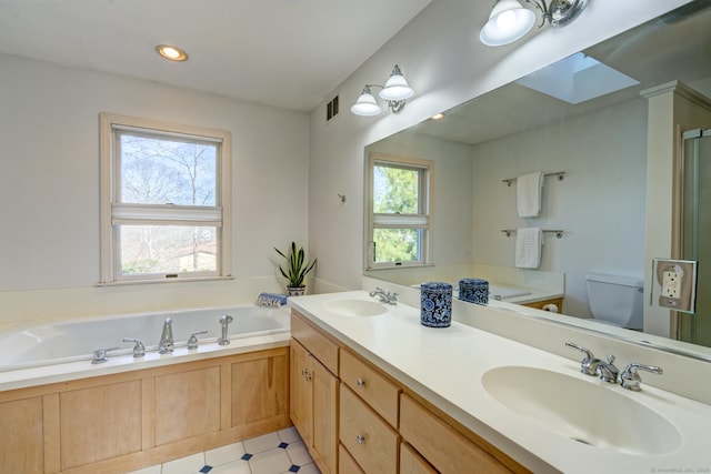 37 Skyline Dr, Groton, CT 06340 - bathroom with plenty of natural light, a garden tub, double vanity, recessed lighting, and a shower with shower door