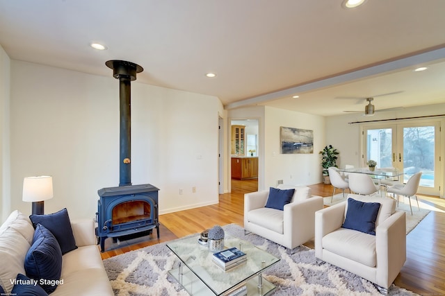 37 Skyline Dr, Groton, CT 06340 - living room with a wood stove, french doors, light wood-style floors, and recessed lighting