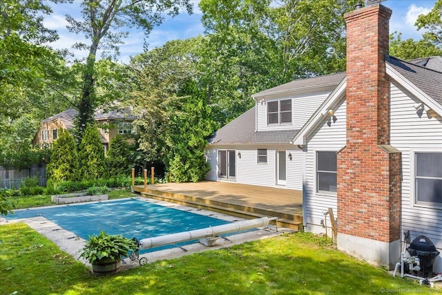 37 Skyline Dr, Groton, CT 06340 - rear view of property featuring a deck, a chimney, and a shingled roof