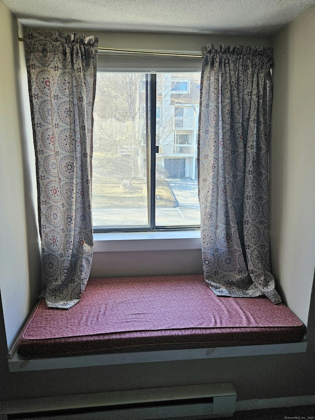 interior details featuring a textured ceiling