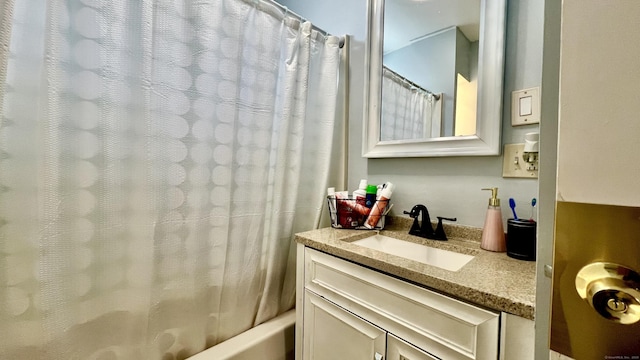 full bathroom with shower / bathtub combination with curtain and vanity