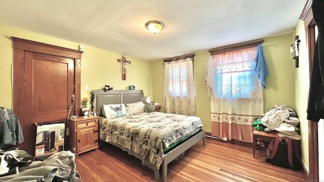 bedroom with wood finished floors