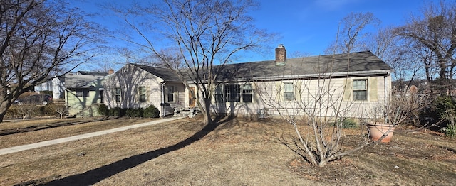 view of front of home with a chimney