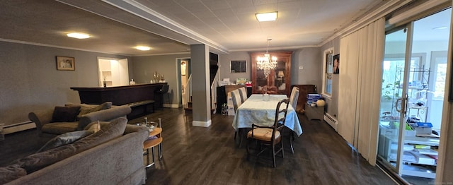 dining space featuring a baseboard heating unit, a notable chandelier, ornamental molding, and dark wood-style flooring