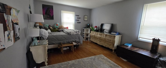 bedroom with wood finished floors