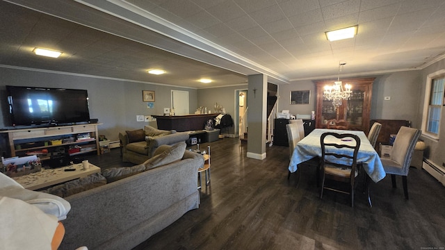 living room with baseboards, an inviting chandelier, ornamental molding, and dark wood-style flooring