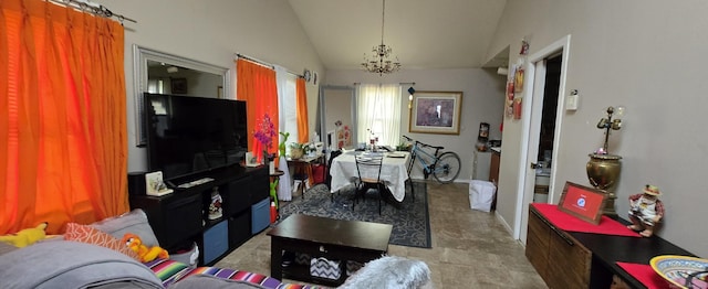 living area with an inviting chandelier and vaulted ceiling