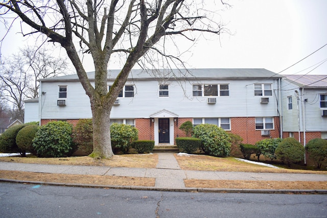 townhome / multi-family property featuring brick siding