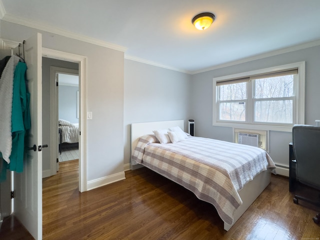 bedroom featuring a baseboard radiator, baseboards, a wall mounted AC, dark wood finished floors, and crown molding