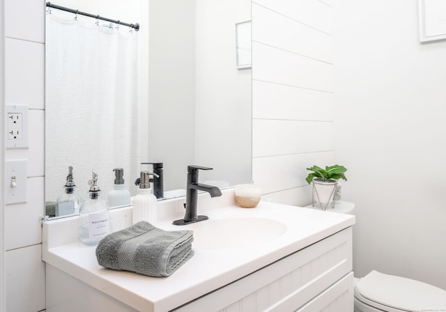 bathroom with vanity and toilet