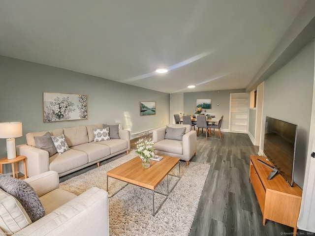 living room with baseboards and wood finished floors