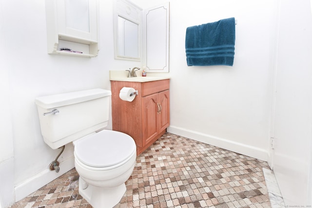 333 Vincellette St Unit 16, Bridgeport, CT 06606 - half bathroom with toilet, baseboards, and vanity