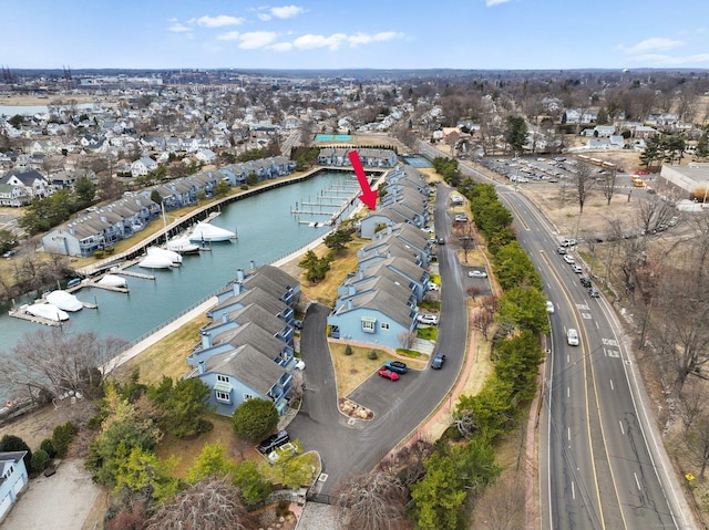 bird's eye view featuring a residential view and a water view