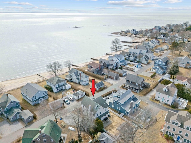 drone / aerial view featuring a residential view and a water view