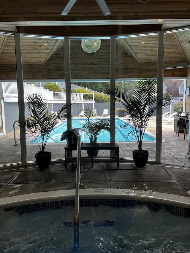 view of pool with a fenced in pool, fence, and a patio