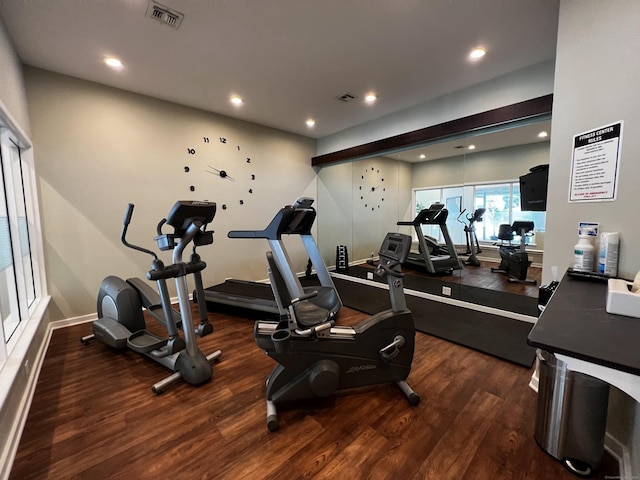 gym with baseboards, visible vents, wood finished floors, and recessed lighting