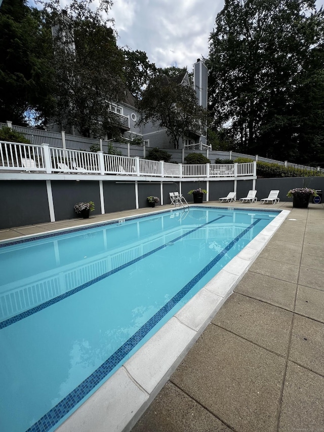 community pool featuring fence