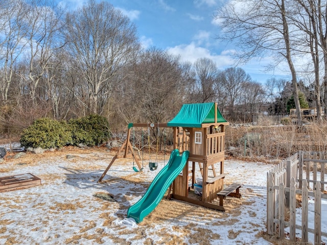 snow covered playground featuring playground community