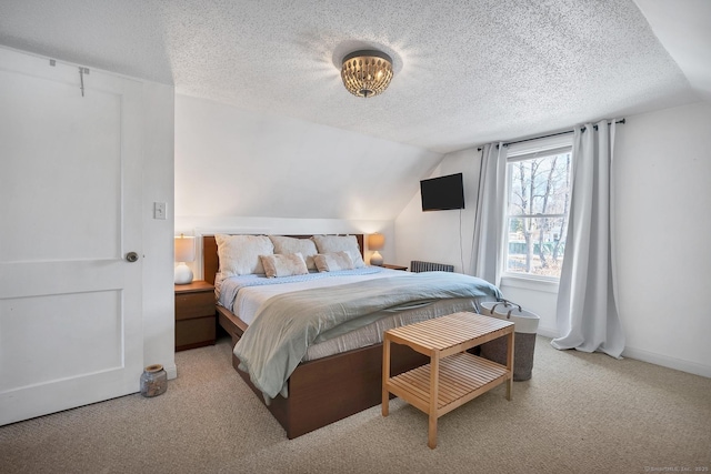 bedroom featuring lofted ceiling, light colored carpet, a textured ceiling, and baseboards