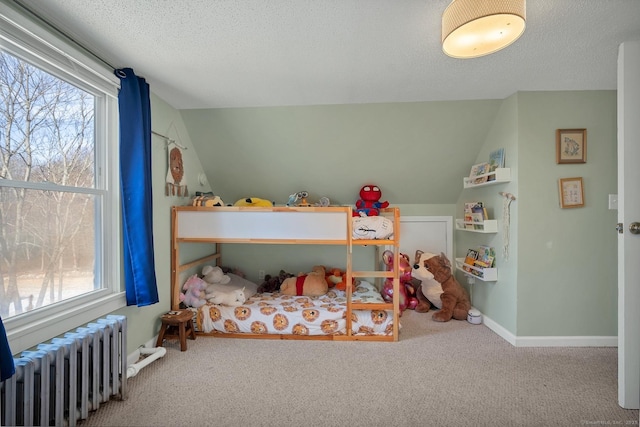 carpeted bedroom featuring a textured ceiling, radiator heating unit, and lofted ceiling