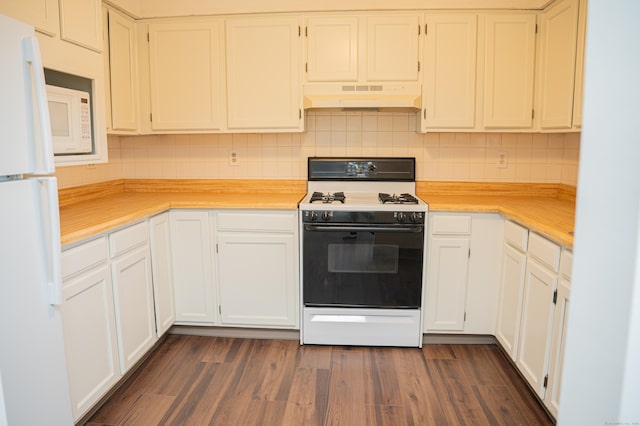 kitchen with white appliances, light countertops, under cabinet range hood, and dark wood-style flooring