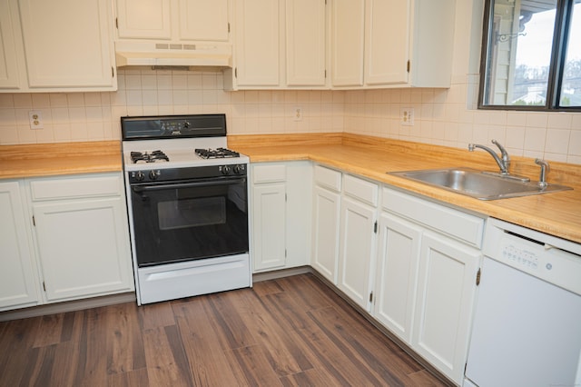 kitchen with dishwasher, range with gas cooktop, light countertops, under cabinet range hood, and a sink