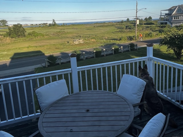 wooden deck with outdoor dining space