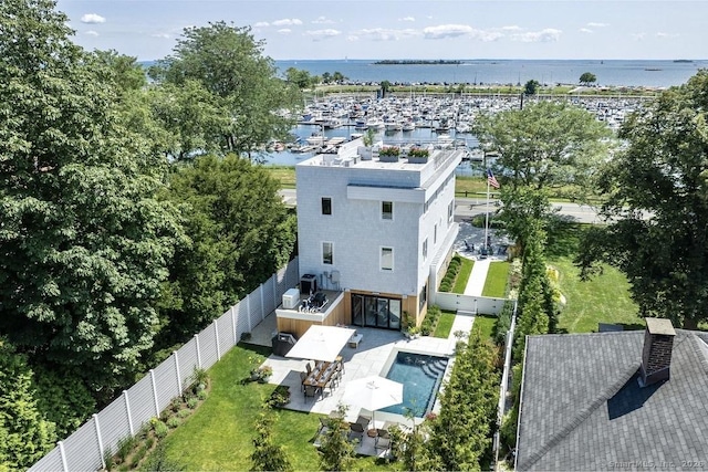 birds eye view of property with a water view