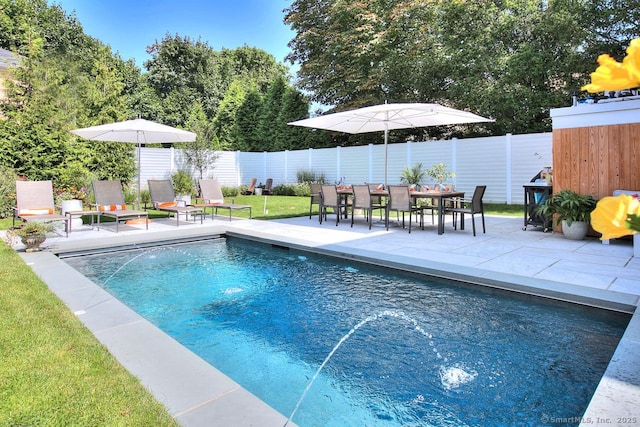 view of swimming pool featuring a yard, a fenced backyard, a fenced in pool, and a patio