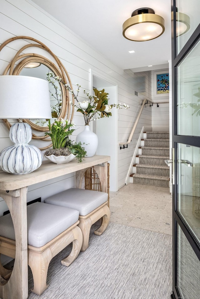 interior space with wooden walls and stairs