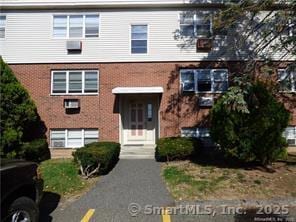 view of front of property featuring brick siding