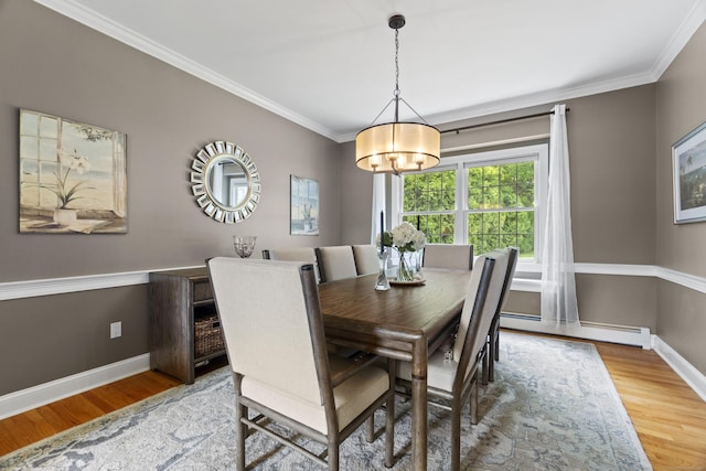 3 Spencer Ct, Clinton, CT 06413 - dining area featuring a baseboard radiator, wood finished floors, a chandelier, crown molding, and baseboards