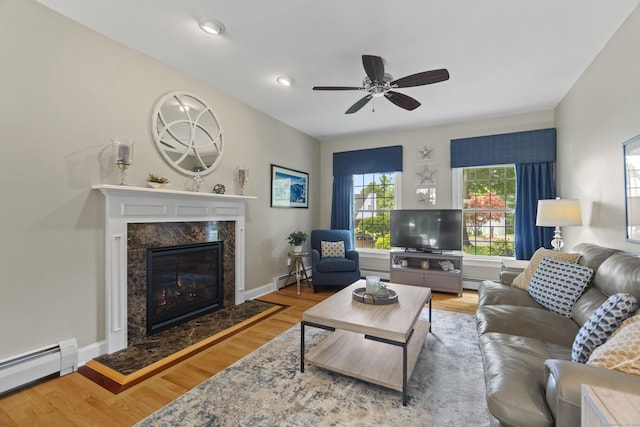 3 Spencer Ct, Clinton, CT 06413 - living area with a baseboard heating unit, wood finished floors, a ceiling fan, and recessed lighting