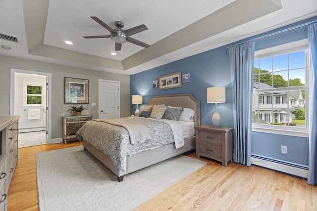 3 Spencer Ct, Clinton, CT 06413 - bedroom featuring a tray ceiling, a baseboard heating unit, multiple windows, and recessed lighting