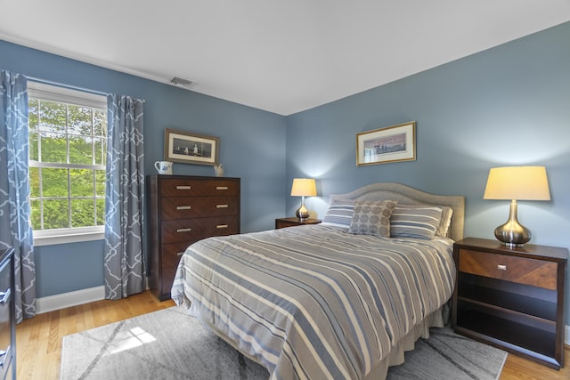 3 Spencer Ct, Clinton, CT 06413 - bedroom with wood finished floors, multiple windows, and baseboards