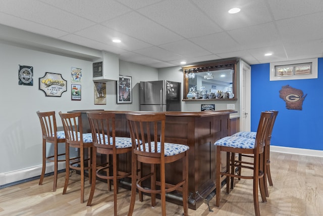 3 Spencer Ct, Clinton, CT 06413 - indoor dry bar featuring freestanding refrigerator, wood finished floors, baseboards, a paneled ceiling, and recessed lighting