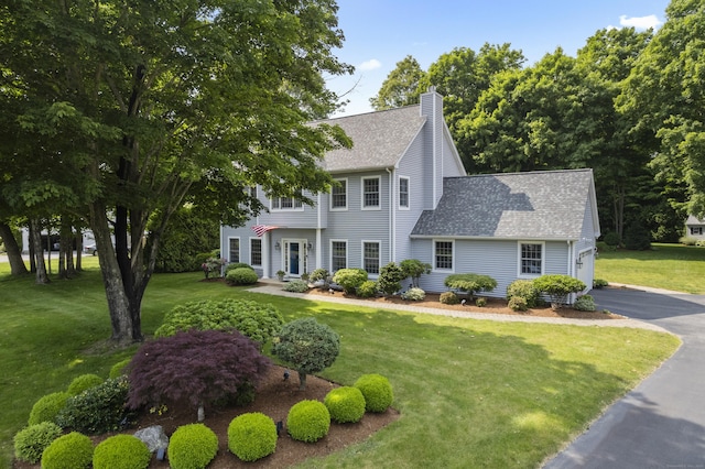 3 Spencer Ct, Clinton, CT 06413 - colonial inspired home featuring a chimney, a shingled roof, and a front yard