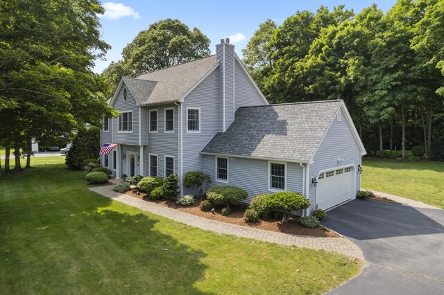 3 Spencer Ct, Clinton, CT 06413 - view of front facade with a shingled roof, driveway, a chimney, a front lawn, and a garage