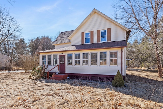 view of front of house with entry steps and roof with shingles