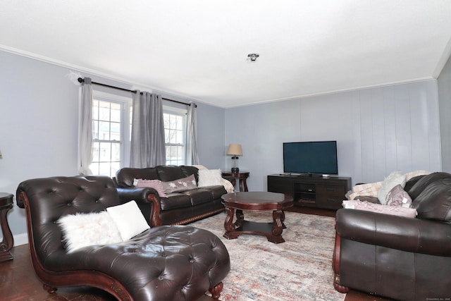 living room with crown molding and wood finished floors