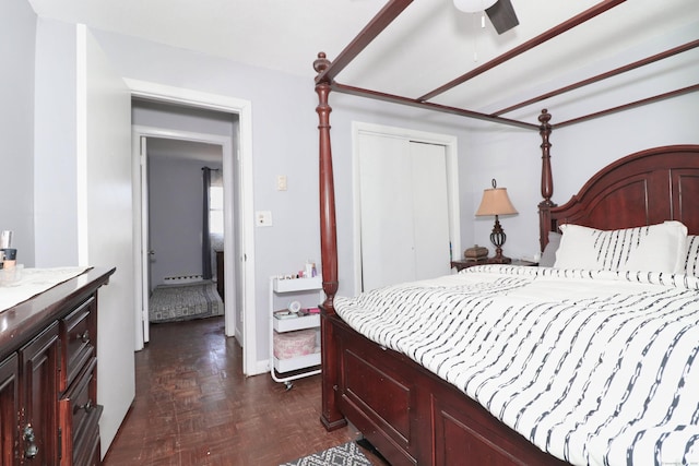 bedroom with a closet, baseboards, and ceiling fan